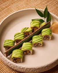 Avocado dragon roll drizzled with eel sauce