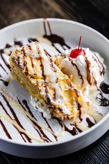 Tempura dessert topped with a cherry